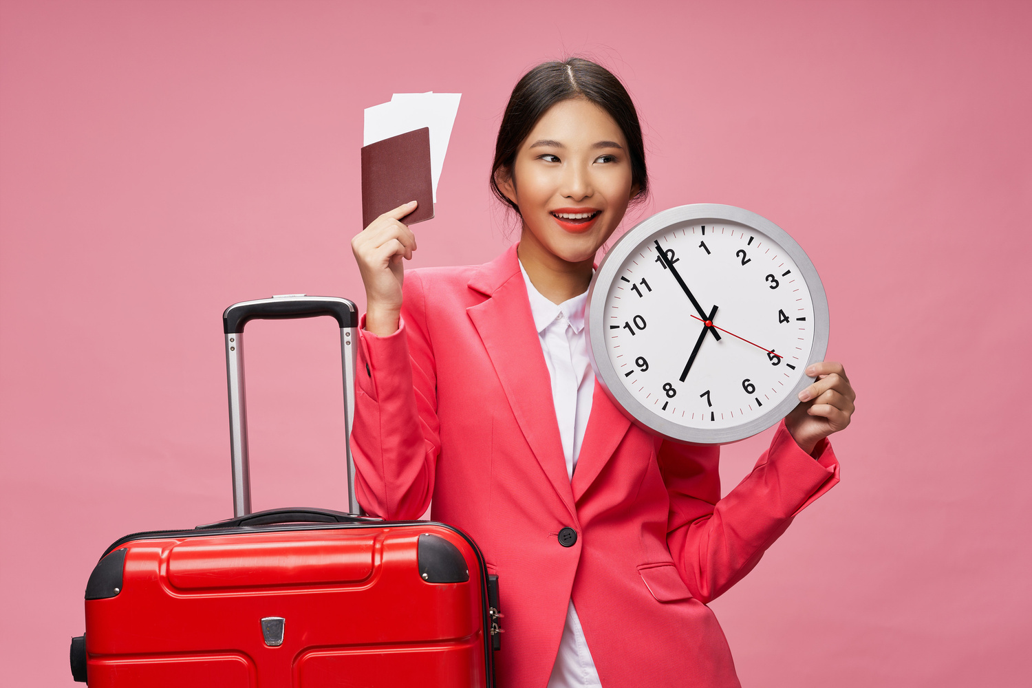 Female in Red Blazer Holding Passport, Tickets and a Clock
